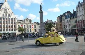 Lille guided tour by Citroen 2CV with Champagne Break